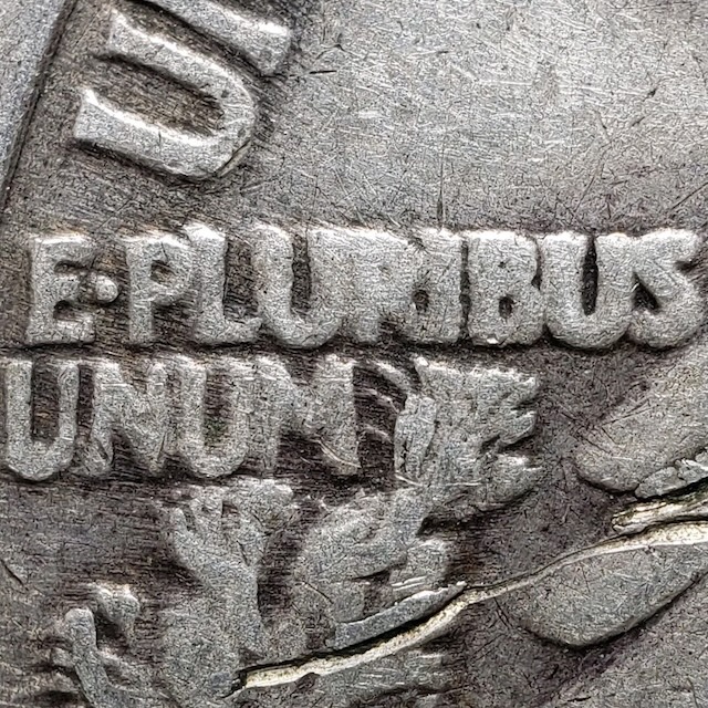 1946 Walking Liberty Half Dollar DDR FS-801 error close-up showing doubled E PLURIBUS UNUM and eagle wing feathers
